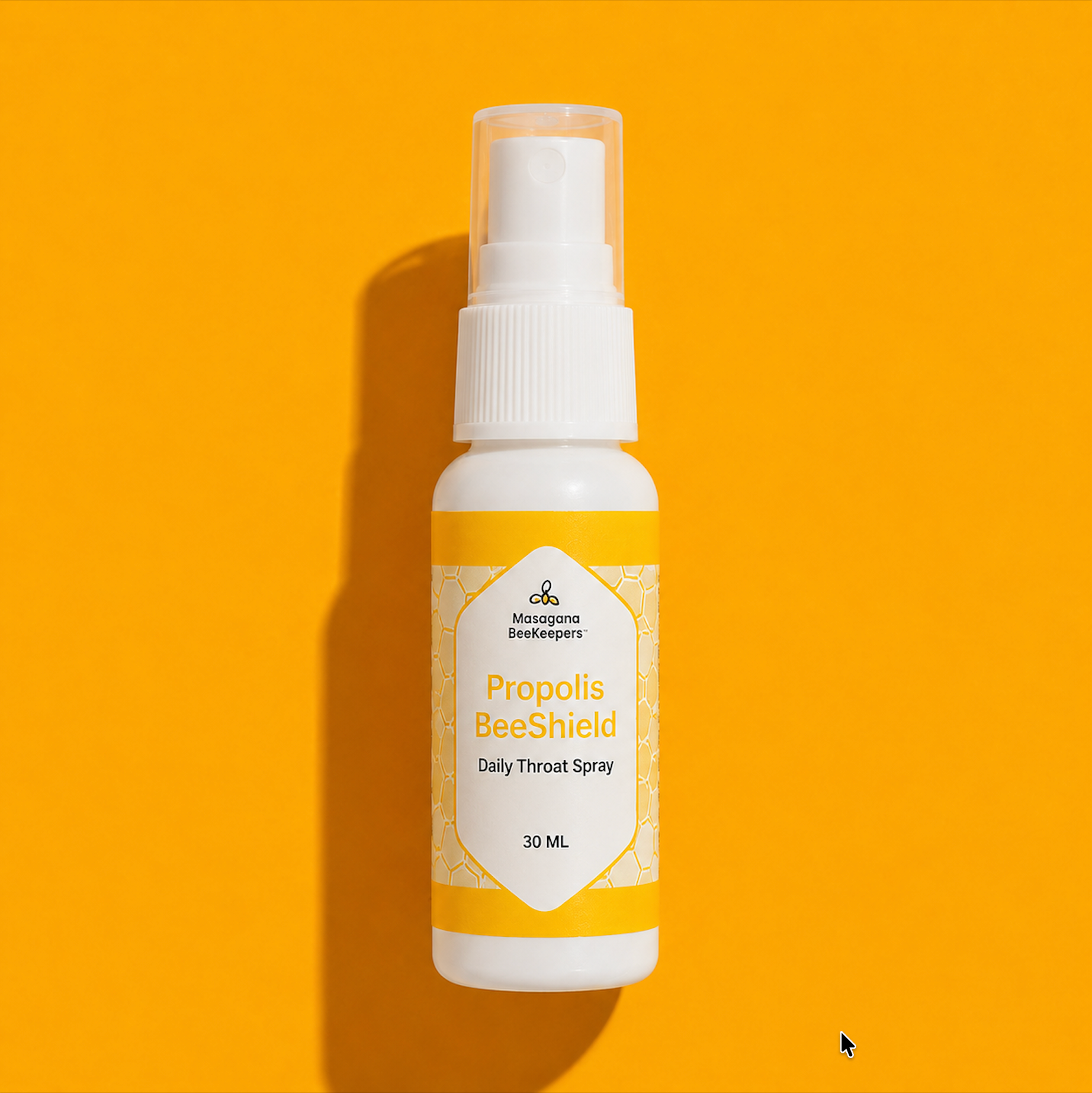 Propolis BeeShield daily throat spray bottle on a yellow background