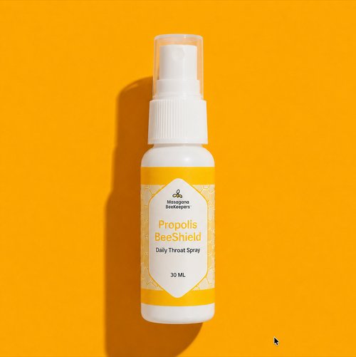Propolis BeeShield daily throat spray bottle on a yellow background